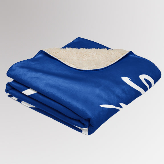 Neatly folded Rotary sherpa blanket with “Service Above Self” text partially visible and sherpa lining exposed.