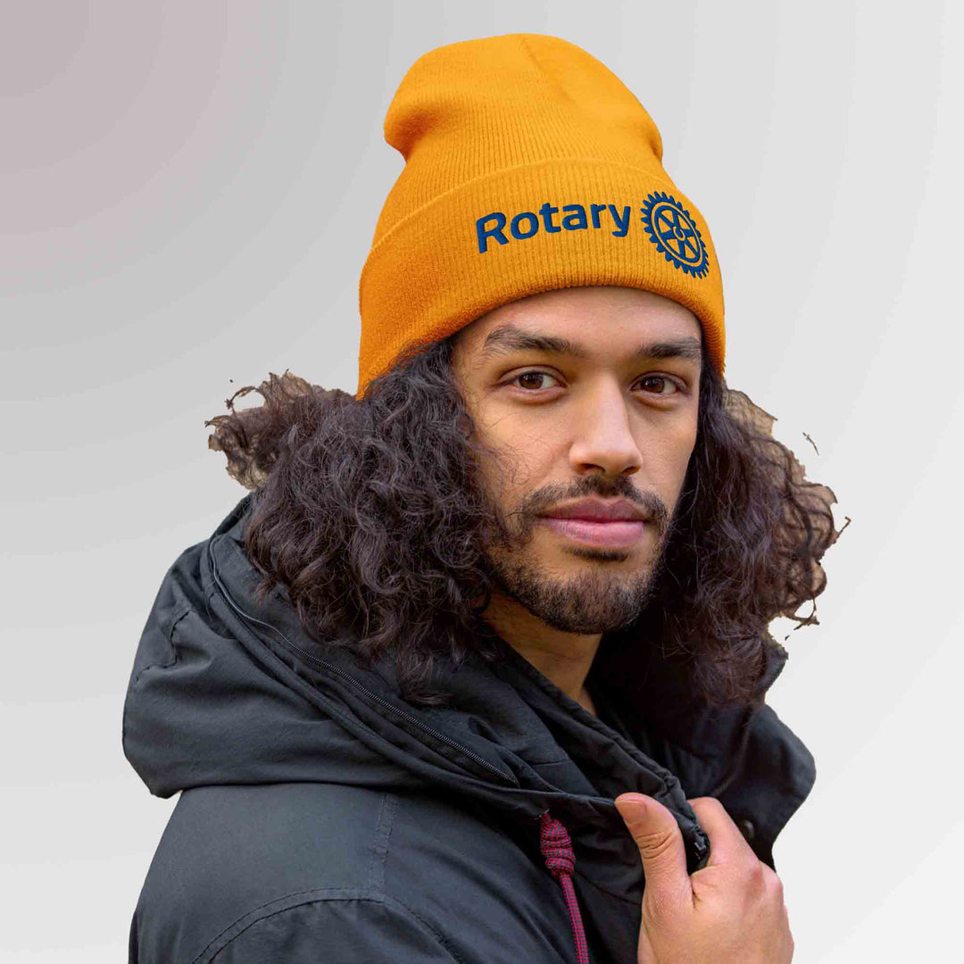 Man wearing Master brand gold color embroidered beanie rotary international high quality awards california