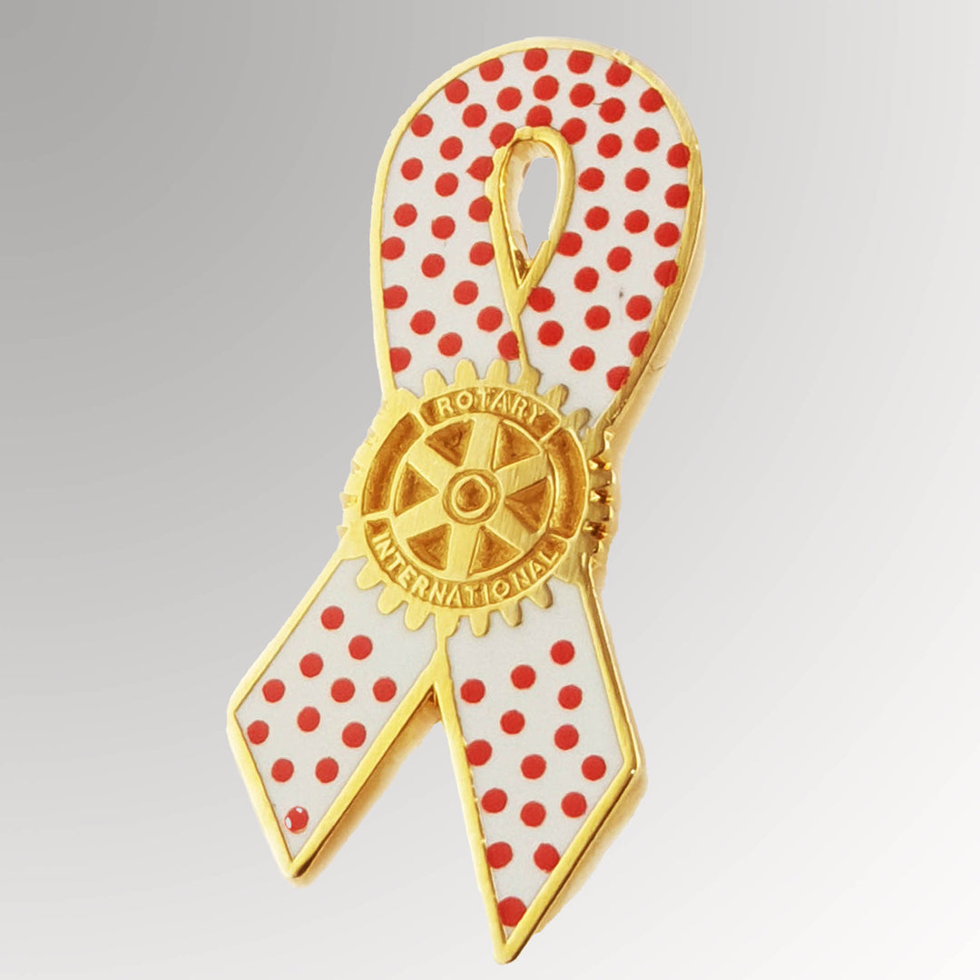 A gold-plated Measles Awareness Pin featuring Rotary International's Mark of Excellence logo.