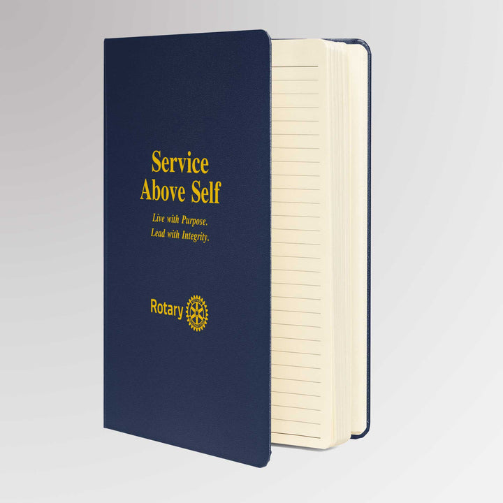 Rotary notebook opened to show cream-colored lined pages with a matching ribbon page marker and expandable inner pocket.