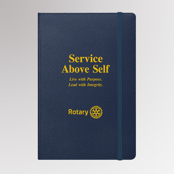 Rotary “Service Above Self” navy blue notebook featuring gold foil text and the official Rotary International Masterbrand logo on the front cover.