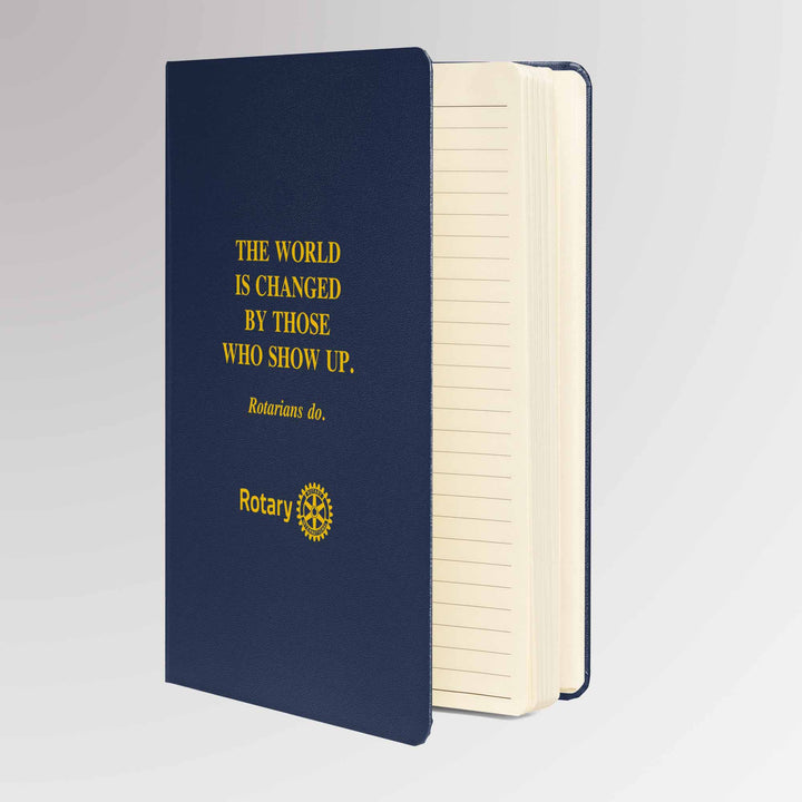 Angled view of the Rotary notebook showing cream-colored lined pages and sturdy UltraHyde cover with gold foil imprint.