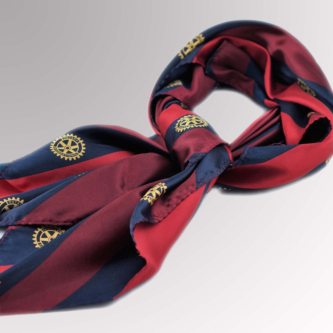 A square-shaped microfiber scarf featuring the Rotary International Mark of Excellence.