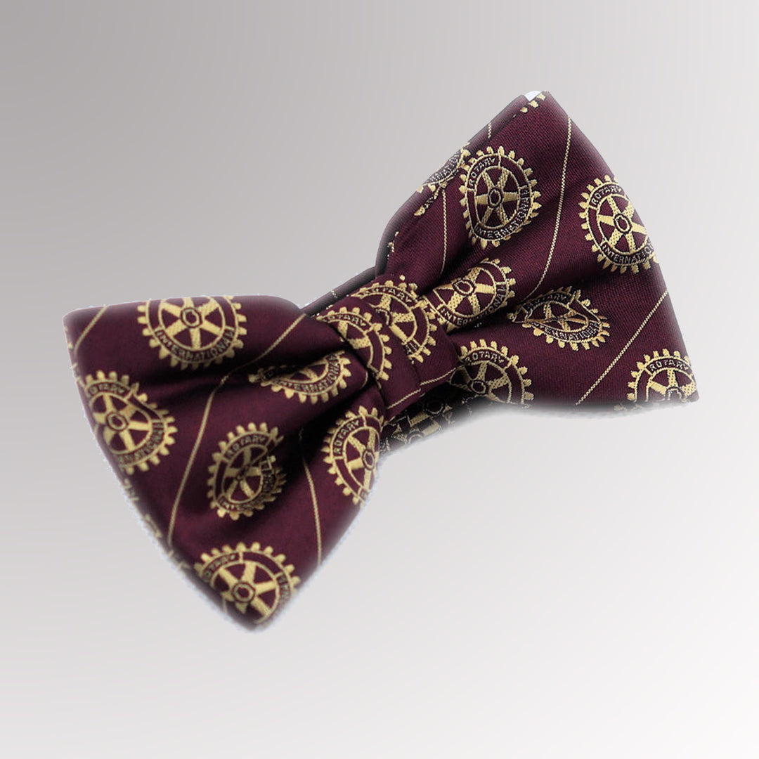 A pre-tied maroon bow tie with a gold Mark of Excellence logo, made from woven fabric.