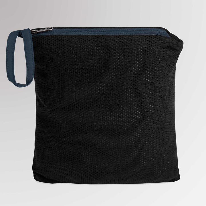 Black zippered pouch containing the folded Champion jacket, demonstrating the packable feature for easy storage.