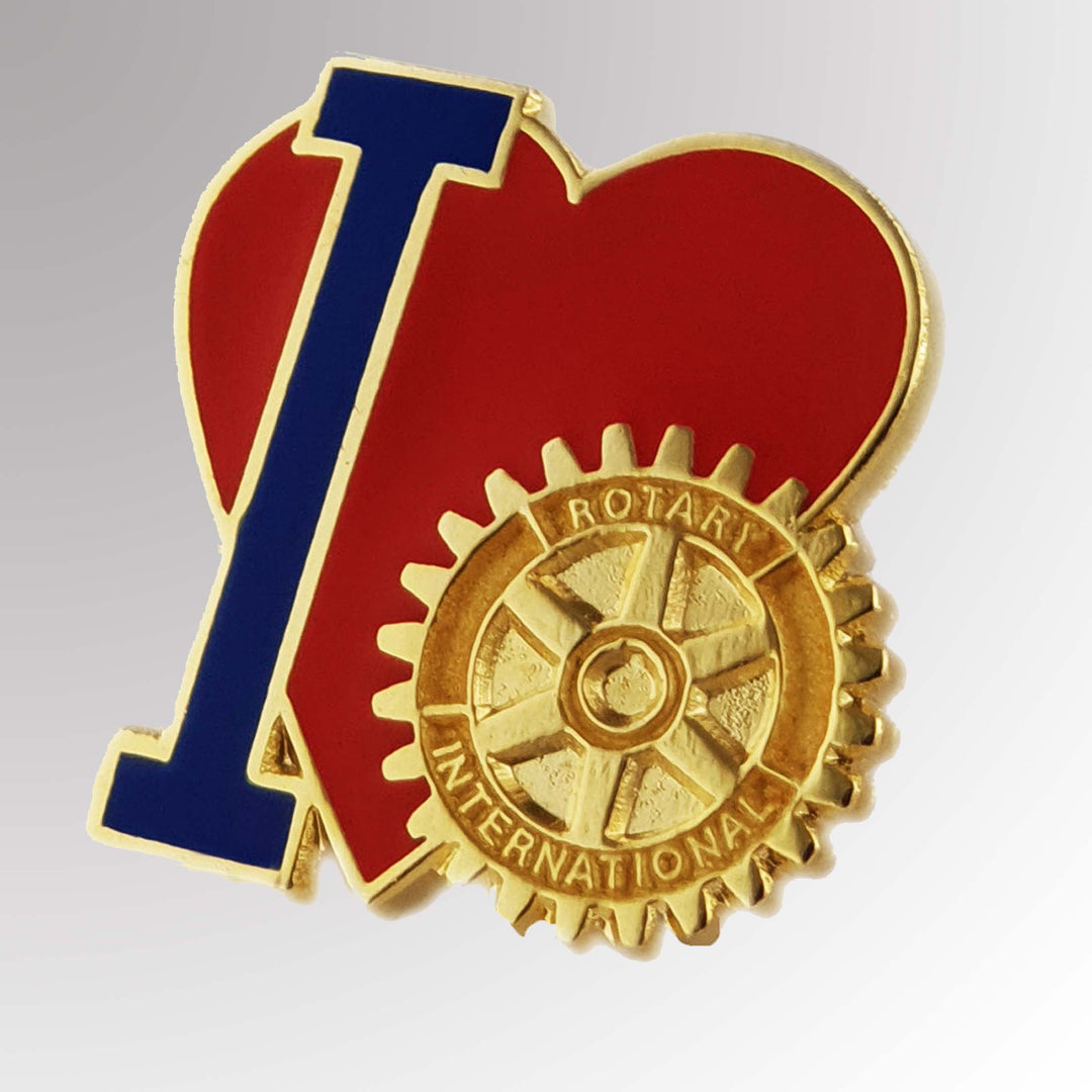 A gold-plated "I Love Rotary" pin featuring Rotary International's Mark of Excellence logo.