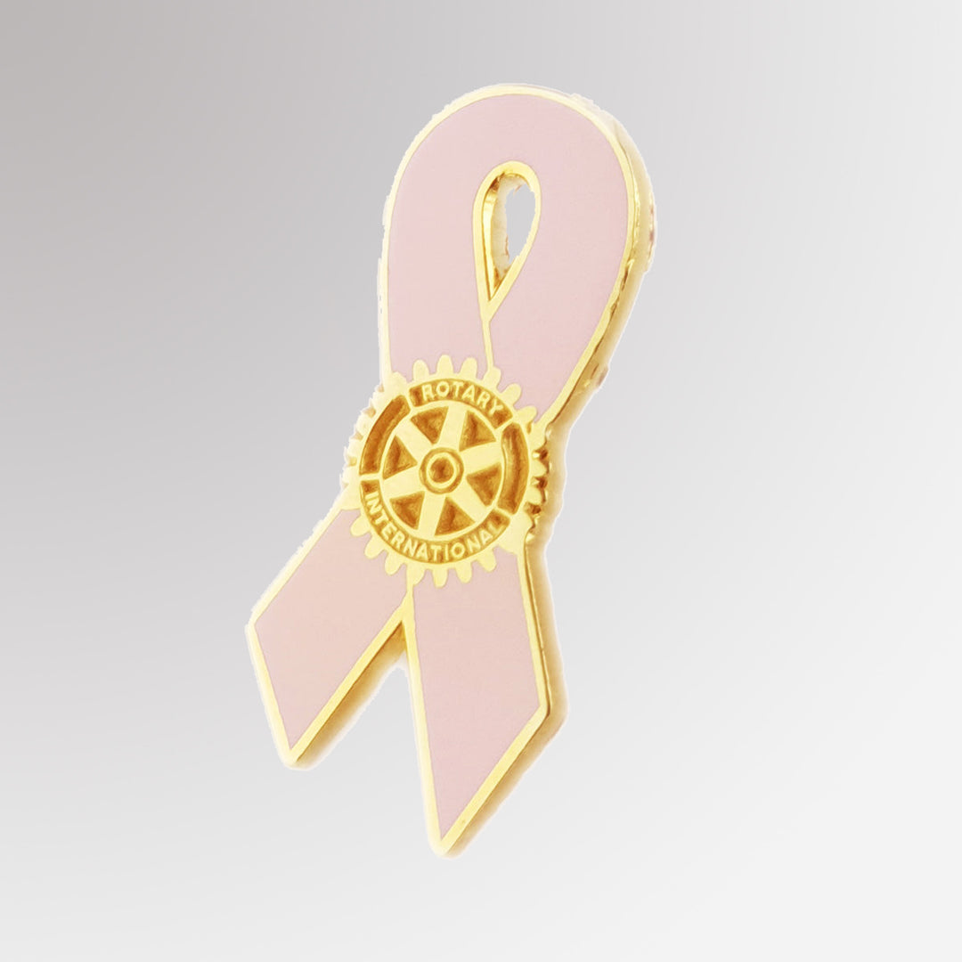 A polished metal breast cancer awareness pin featuring Rotary International's Mark of Excellence logo and a cancer ribbon design.