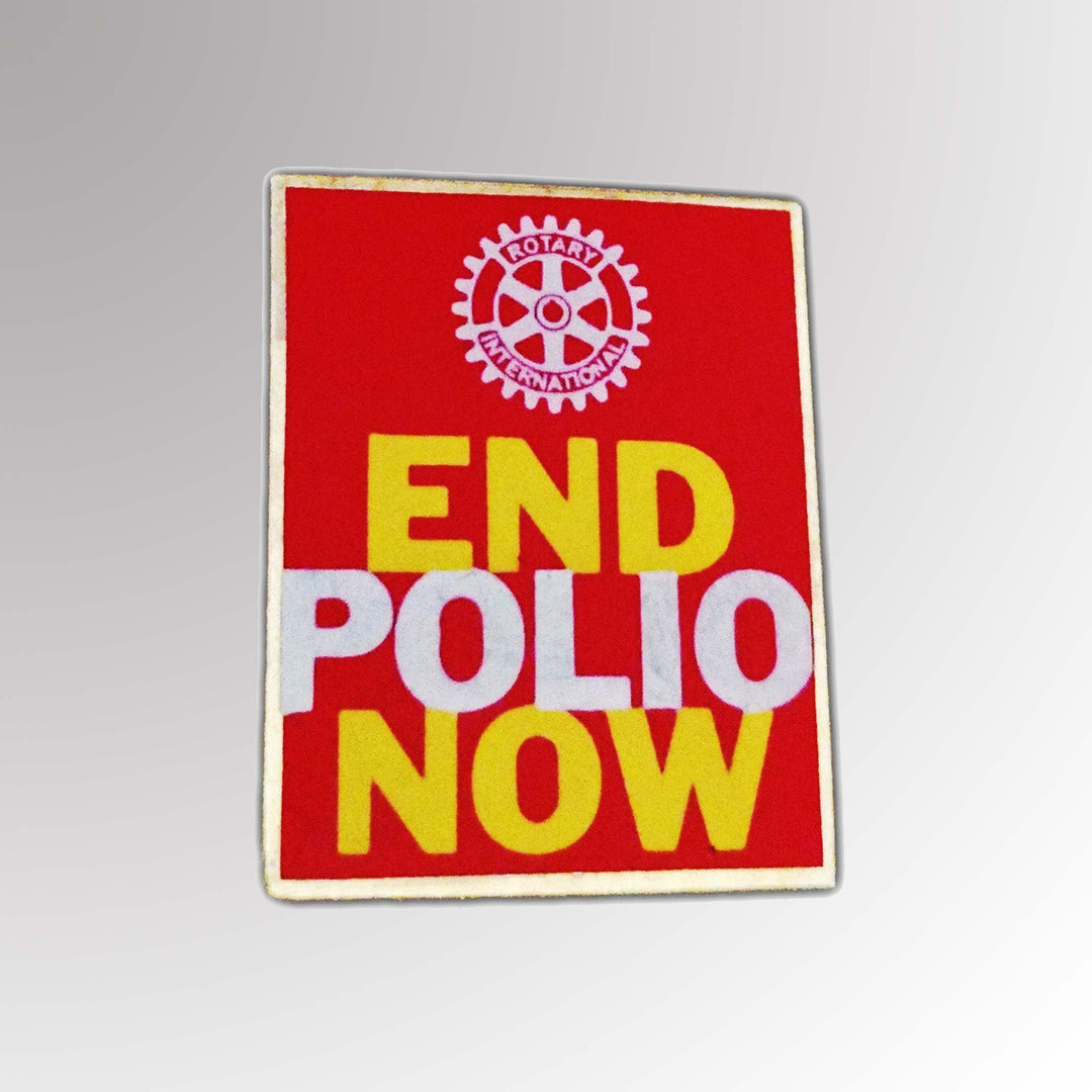 A high-quality End Polio Pin featuring Rotary International's Mark of Excellence logo with a vibrant enamel finish.