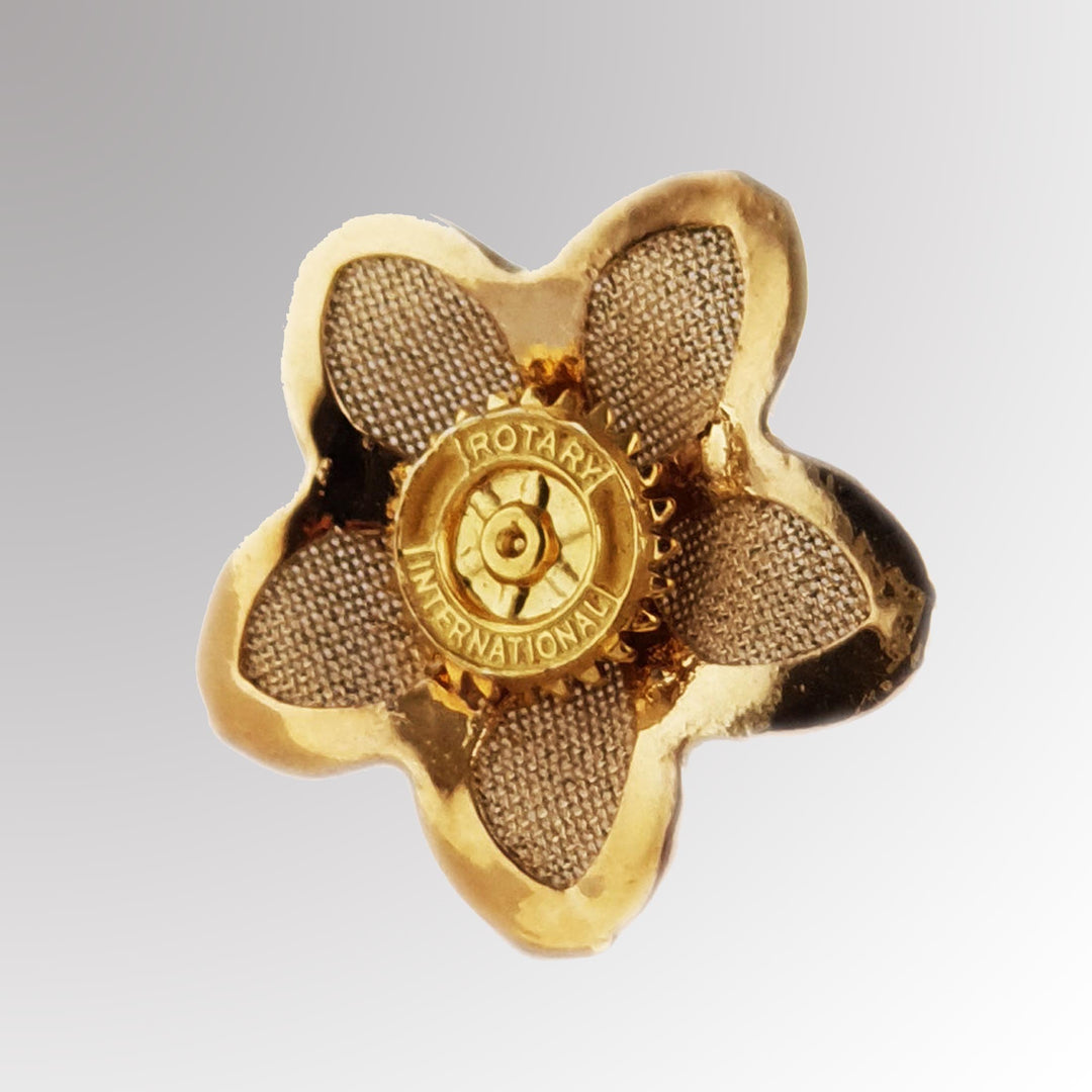 A high-quality Fancy Flower Pin featuring Rotary International's Mark of Excellence logo with an intricate flower design.