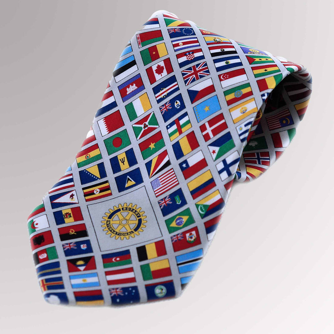 A high-quality silk tie featuring multi-national flags and the Rotary Mark of Excellence logo.