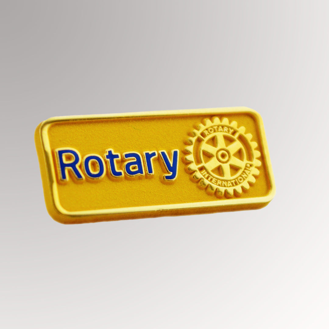 A gold-plated Master Brand Member Pin featuring Rotary International's logo with a matte background.