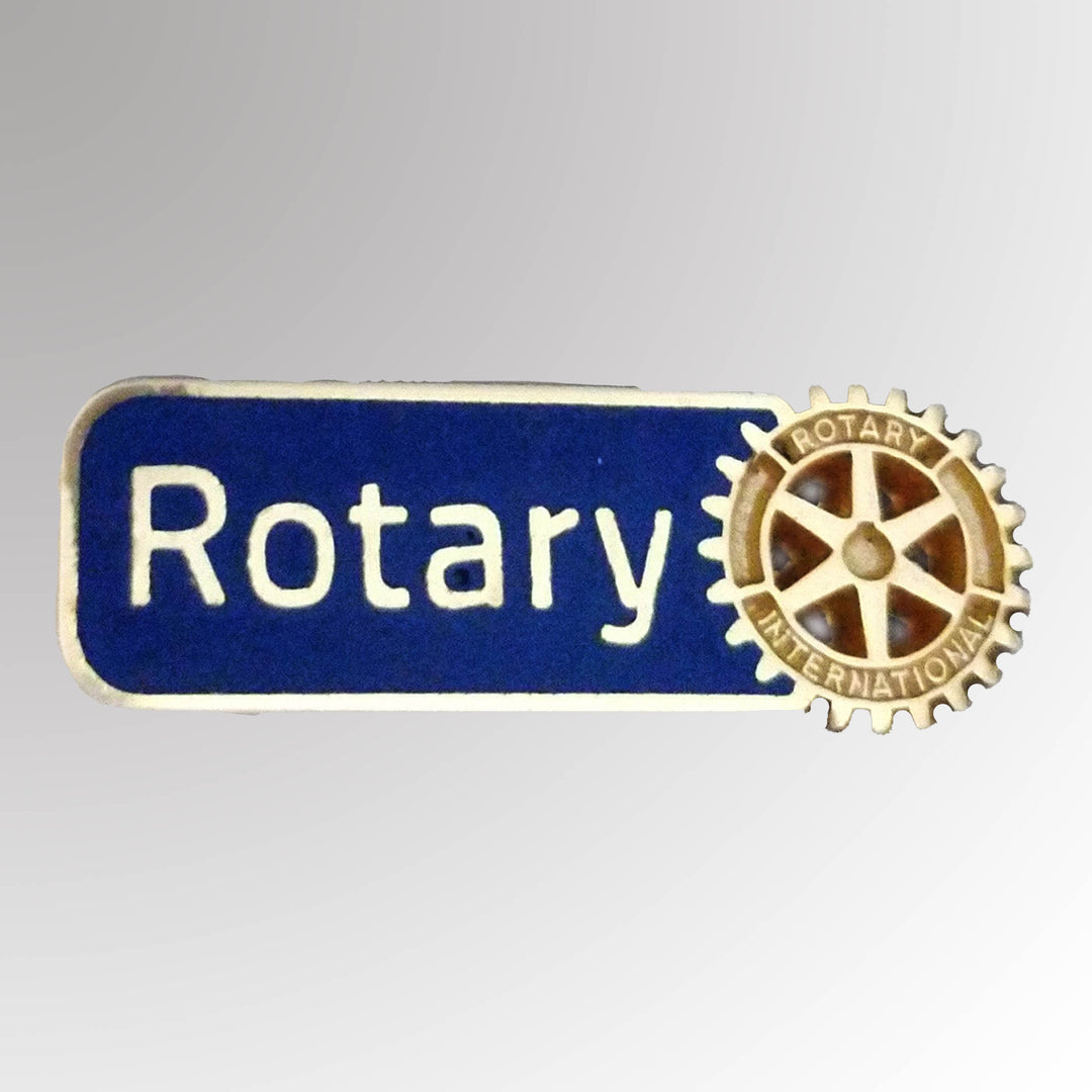 A matte gold-plated lapel pin featuring Rotary International's Master Brand logo.