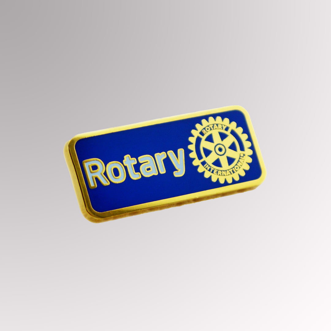 A gold-plated Master Brand Member Pin featuring Rotary International's logo with a blue background.