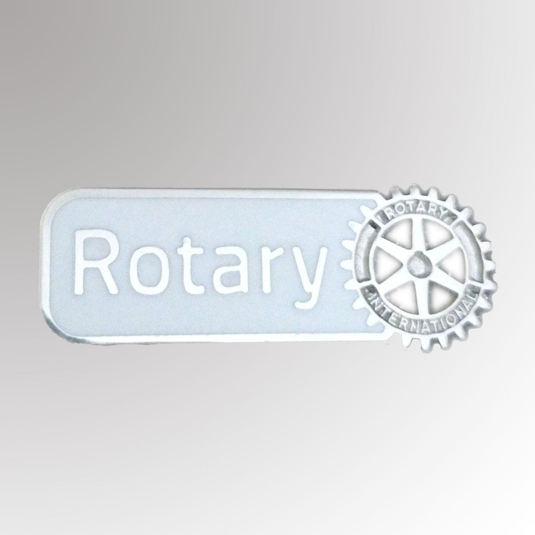 A matte gold-plated lapel pin featuring Rotary International's Master Brand logo.