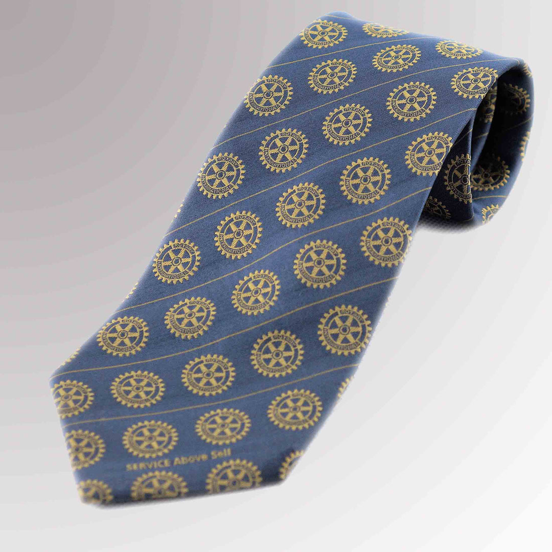 A woven silk tie with a grey background featuring Rotary International's Gold Mark of Excellence.