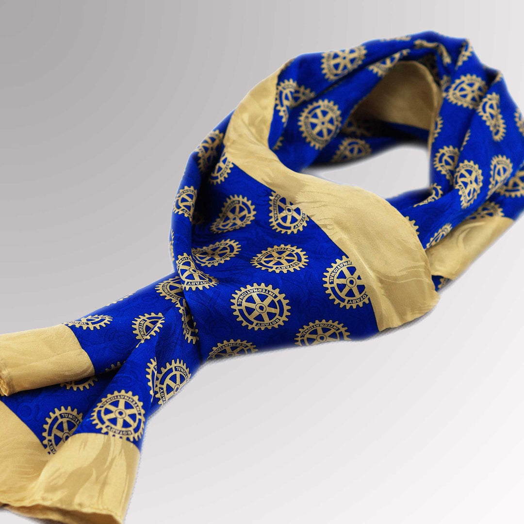 A high-quality silk scarf featuring Rotary International's Mark of Excellence.