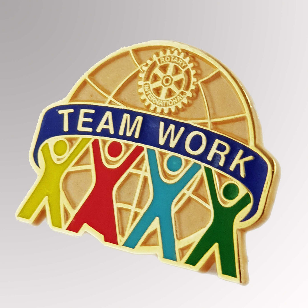 A gold-plated Teamwork Pin featuring the Rotary International Mark of Excellence.