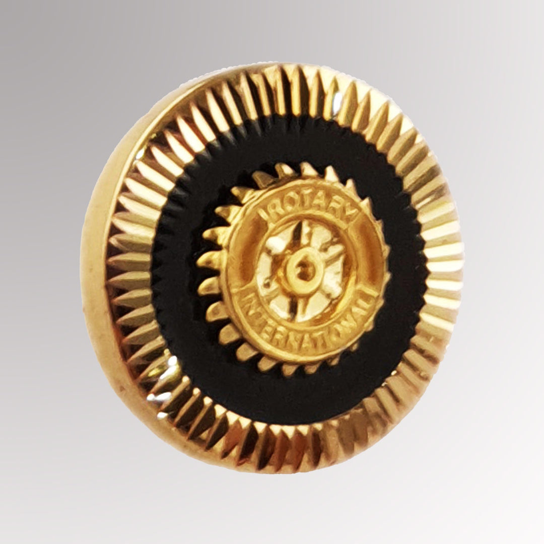 A gold-plated Member Pin Tie Tag featuring Rotary International's Mark of Excellence logo, designed for versatile use.
