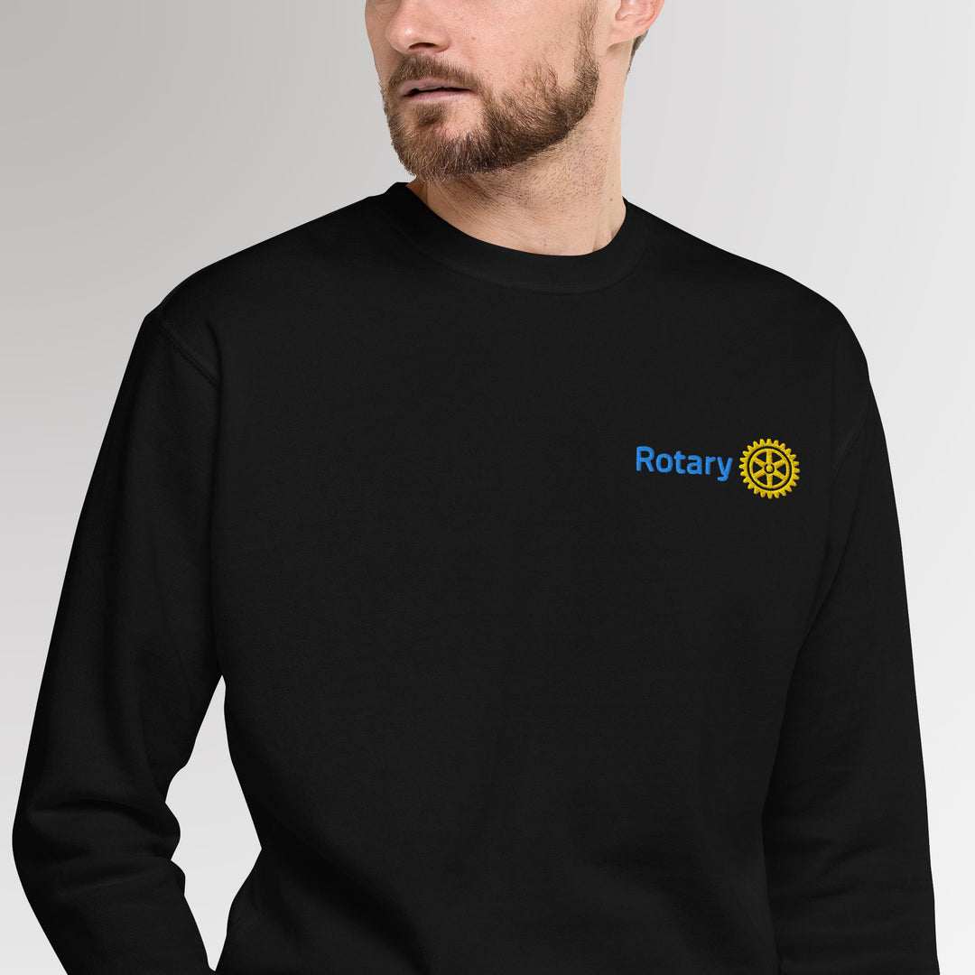 Male model showcasing black colored  high-quality unisex premium sweatshirt with Rotary International Master Brand logo embroidered by Awards California