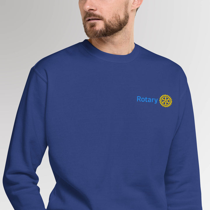 Male model showcasing the blue colored high-quality unisex premium sweatshirt with Rotary International Master Brand logo embroidered by Awards California